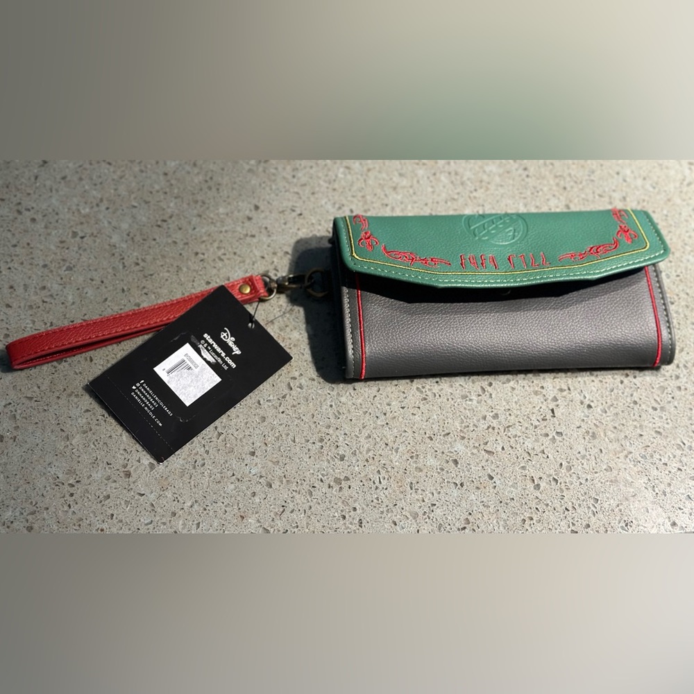 Brand new Danielle Nicole wristlet wallet. Measures 7.5”x4”